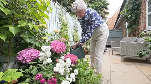 BBC/Mark Norman Mary gardening after her treatment