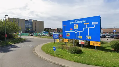 Google Ipswich Hospital exterior showing direction signage