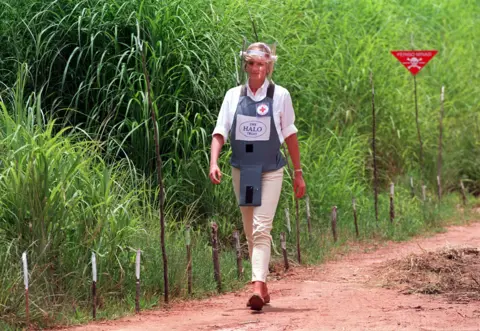 PA Media Princess Diana walking through a path cleared through a minefield in Angola in 1997