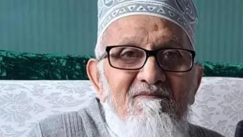 Supplied A photo of Qari Ismaeel Khandia looking down. He is wearing glasses and has a grey beard 