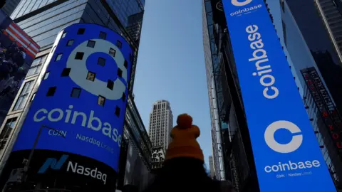 Reuters The logo for Coinbase Global Inc, the biggest U.S. cryptocurrency exchange, is displayed on the Nasdaq MarketSite jumbotron and others at Times Square in New York, U.S., April 14, 2021.