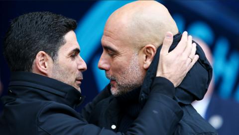 Arsenal boss Mikel Arteta and Manchester City manager Pep Guardiola embrace before kick-off in the Premier League match between the two teams on 31 March 2024