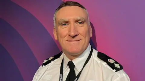Paul Joyce, commander of policing for Coventry, stands looking the camera.