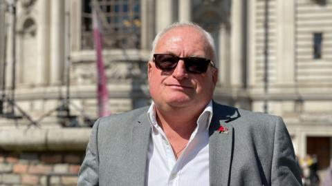 Alan Burgess outside Central Hall Westminster