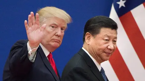 AFP/Getty This file picture taken on November 9, 2017, shows US President Donald Trump (L) and China"s President Xi Jinping leaving a business leaders event at the Great Hall of the People in Beijing