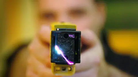 PA Police officer firing a Taser