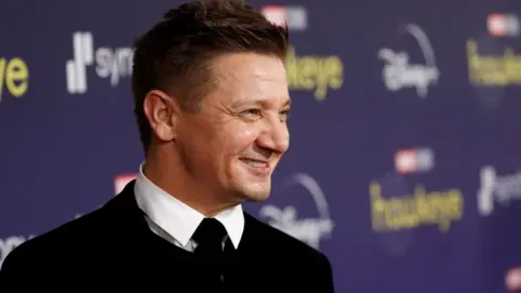 Reuters Actor Jeremy Renner poses for a picture during the premiere of the television series Hawkeye at El Capitan theatre in Los Angeles, California, U.S. November, 17, 2021