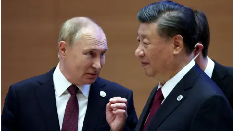 Reuters Russian President Vladimir Putin speaks with Chinese President Xi Jinping