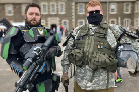 David and James are dressed up in costumes inspired by video game characters.