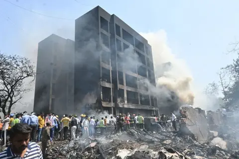 Building surrounded by smoke