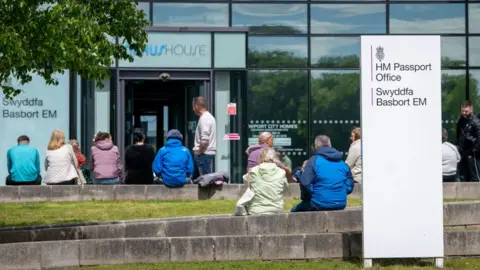 Getty Images Queues outside passport office in Newport