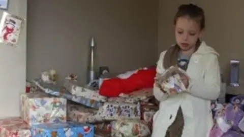 Shaniah Adler  Shaniah unwrapping her presents at Christmas