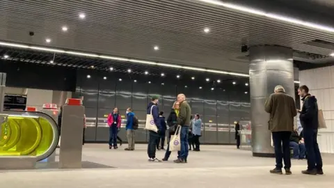 People at a Crossrail station