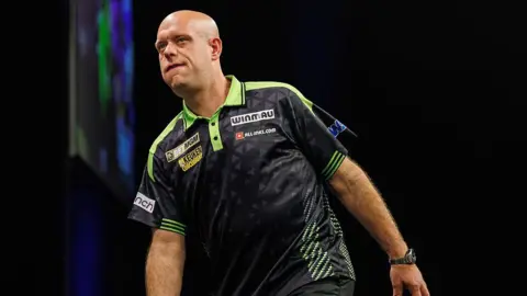 Michael van Gerwen looking frustrated figure during his loss to Luke Humphries 