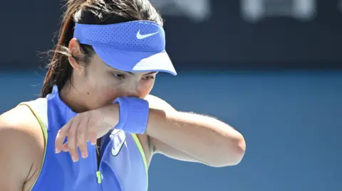 Emma Raducanu reacts during her Australian Open defeat