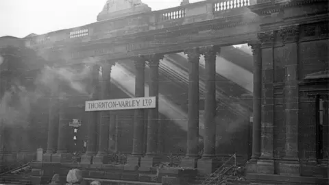 Hull History Centre A black and white image of the bombed out Royal Institution taken in 1943 only the facade with its columns remains and smoke drifts from the interior