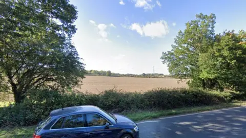 Google Field with car driving past it