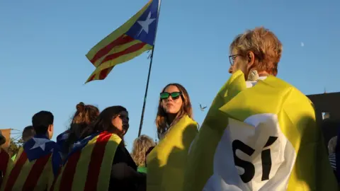 Reuters A woman holds a Catalan separatist flag in Barcelona, 29 October