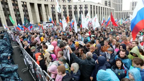 Getty Images People take part in a rally in support of rejected independent candidates in the Moscow City Duma [Moscow parliament] election, in central Moscow, Russia, 10 August 2019