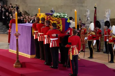 PA Media The Queen's coffin being carried into place in Westminster Hall