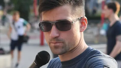 AFP Martin Sellner speaking during a rally organised by IBOe in Vienna, Austria. July 27, 2016