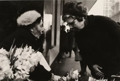 MARZAROLI COLLECTION Flower seller at Copeland's corner, 1968