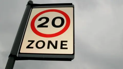 PA Media A 20mph sign