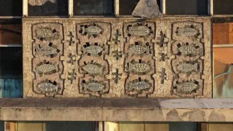 Ships in the Sky the Fish mural exposed