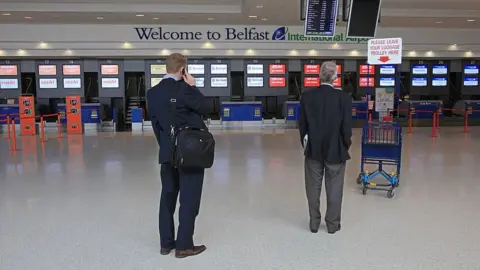 Getty Images Passengers at Belfast International Airport