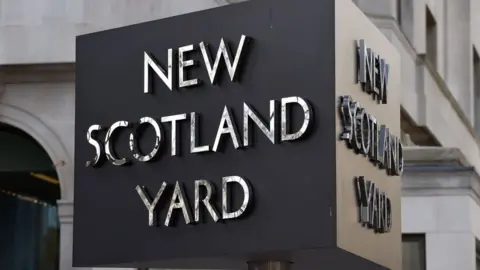 PA Media File photo of the New Scotland Yard sign.