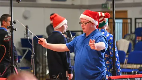 PA Media A conductor at the Music Man Project