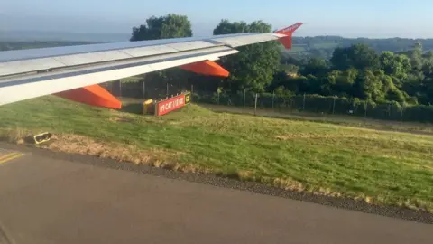 Geograph/Alan Hughes Plane wing with countryside in background