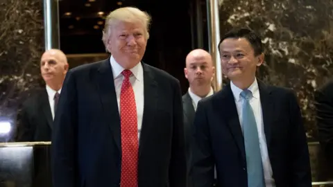 Getty Images President-elect Donald Trump and Jack Ma, Chairman of Alibaba Group, emerge from the elevators to speak to reporters following their meeting at Trump Tower, January 9, 2017 in New York City.