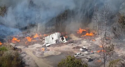 Burnt out vehicles after fire