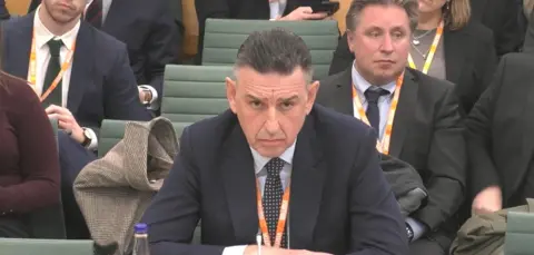 Parliament TV Fujitsu European boss Paul Patterson answers MPs' questions as he appears before the Business and Trade Committee.