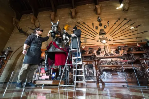 PA Media Staff cleaning armour