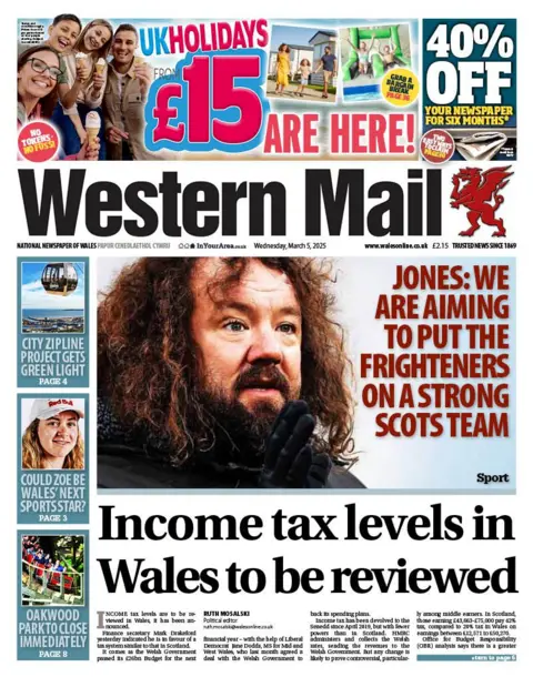 Western Mail Western Mail newspaper front page shows main headline is: Income tax levels in Wales to be reviewed. Other headlines are: Adam Jones: We are aiming to put the frighteners on a strong Scots team. City Zipline project gets green light. Could Zoe be Wales' next sports star. Oakwood Park to close immediately.