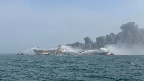 Getty Images Fire and rescue services attend after a collision between oil tanker MV Stena Immaculate and the cargo vessel MV Solong off the coast of the Humber Estuary on March 10, 2025