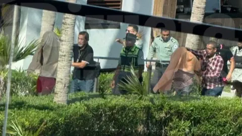 Colin Nulty Undercover police officers detaining suspected members of a cartel at a luxury hotel in Mexico.