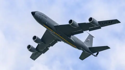 Getty Images A large grey plane in the sky