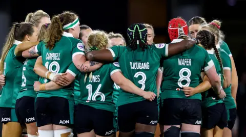 Ireland gather for a huddle after the loss to France