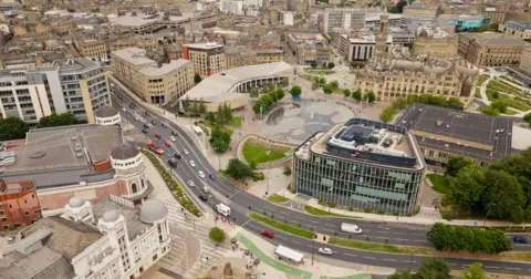Getty Images An aerial view of a large metropolitan city. Landmarks identify it as Bradford.