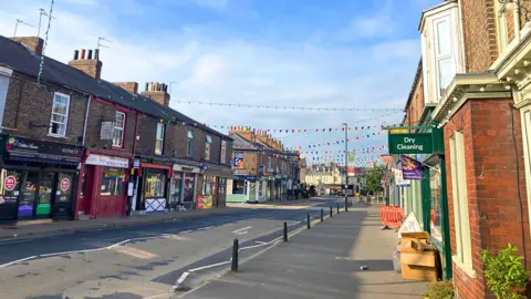 A view of shops and businesses on Bishopthorpe Road in York.