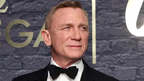 Daniel Craig in a suit as James Bond 