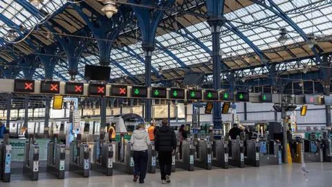 Getty Images Ticket barriers at the railway station in Brighton.