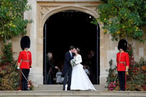 Toby Melville/Reuters Princess Eugenie and Jack Brooksbank kiss as they leave after their wedding at St George's Chapel in Windsor Castle,