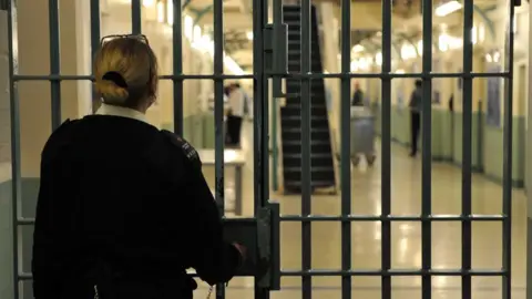 BBC Prison officer locking door