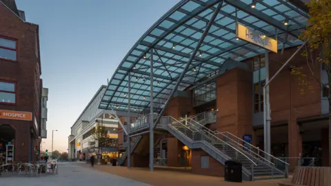 A modern glass and brick building. 