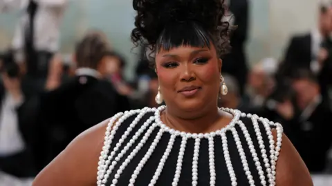 Reuters Lizzo poses at the Met Gala, an annual fundraising gala held for the benefit of the Metropolitan Museum of Art's Costume Institute with this year's theme "Karl Lagerfeld: A Line of Beauty", in New York City, New York, U.S., May 1, 2023.