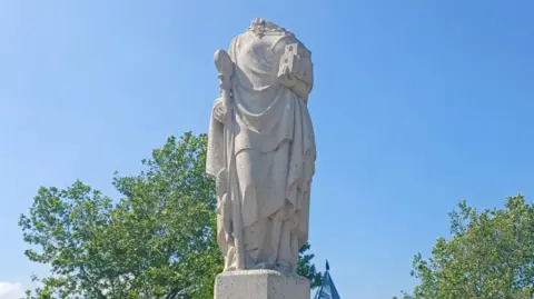 The vandalised St Eanswythe sculpture